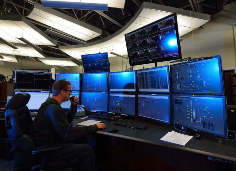 Male worker in a control room