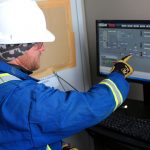 Geophysicist reviewing data on a computer screen