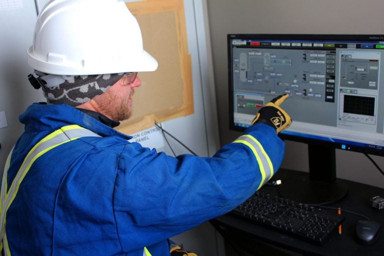 Geophysicist reviewing data on a computer screen